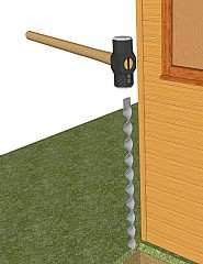 Hammering an anchor into the ground